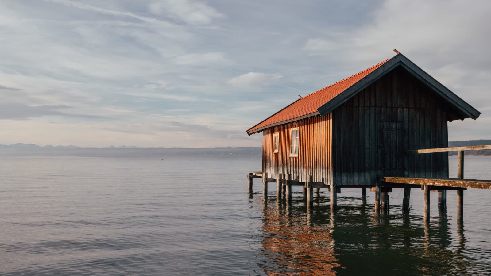 Rustic boathouse at sunset